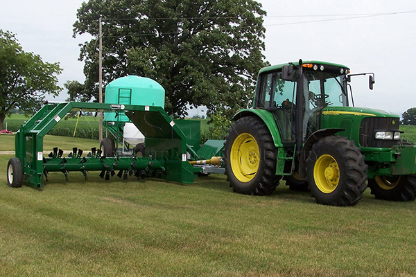 towed windrow compost turner working